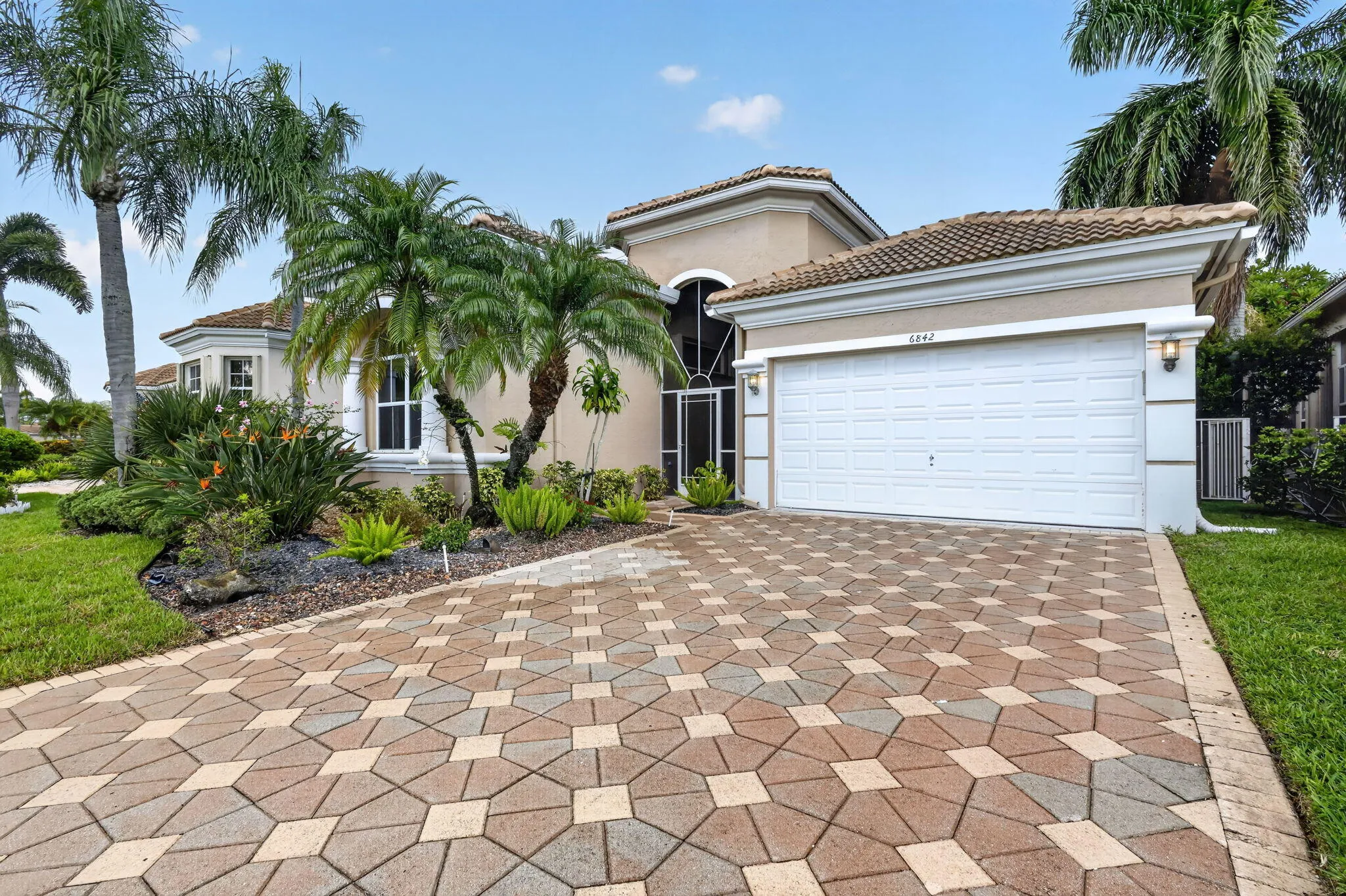 Stucco exterior with a tiled roof