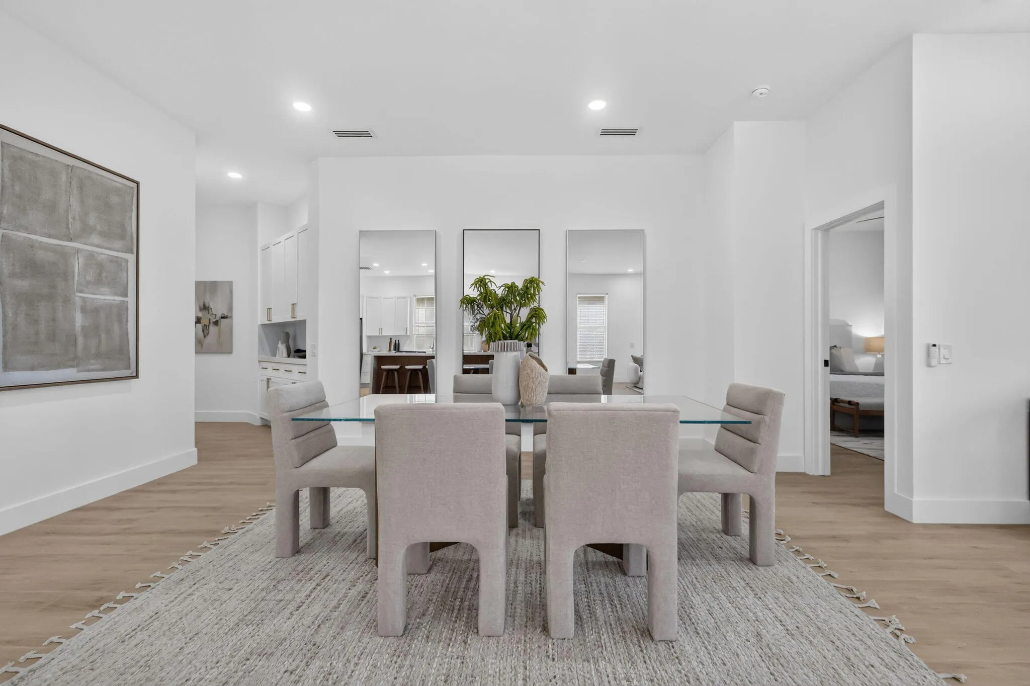Wood-finish flooring throughout, complemented by recessed lighting and high ceilings