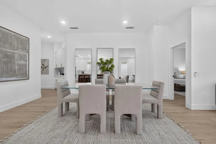 Wood-finish flooring throughout, complemented by recessed lighting and high ceilings