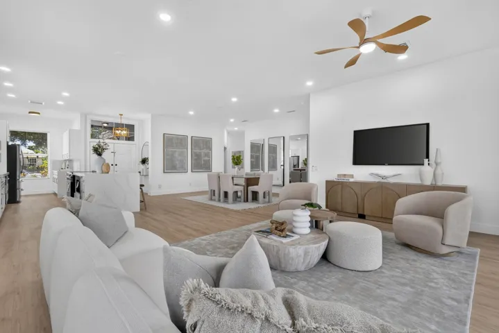 Wood-finish flooring throughout, recessed lighting, and a contemporary ceiling fan
