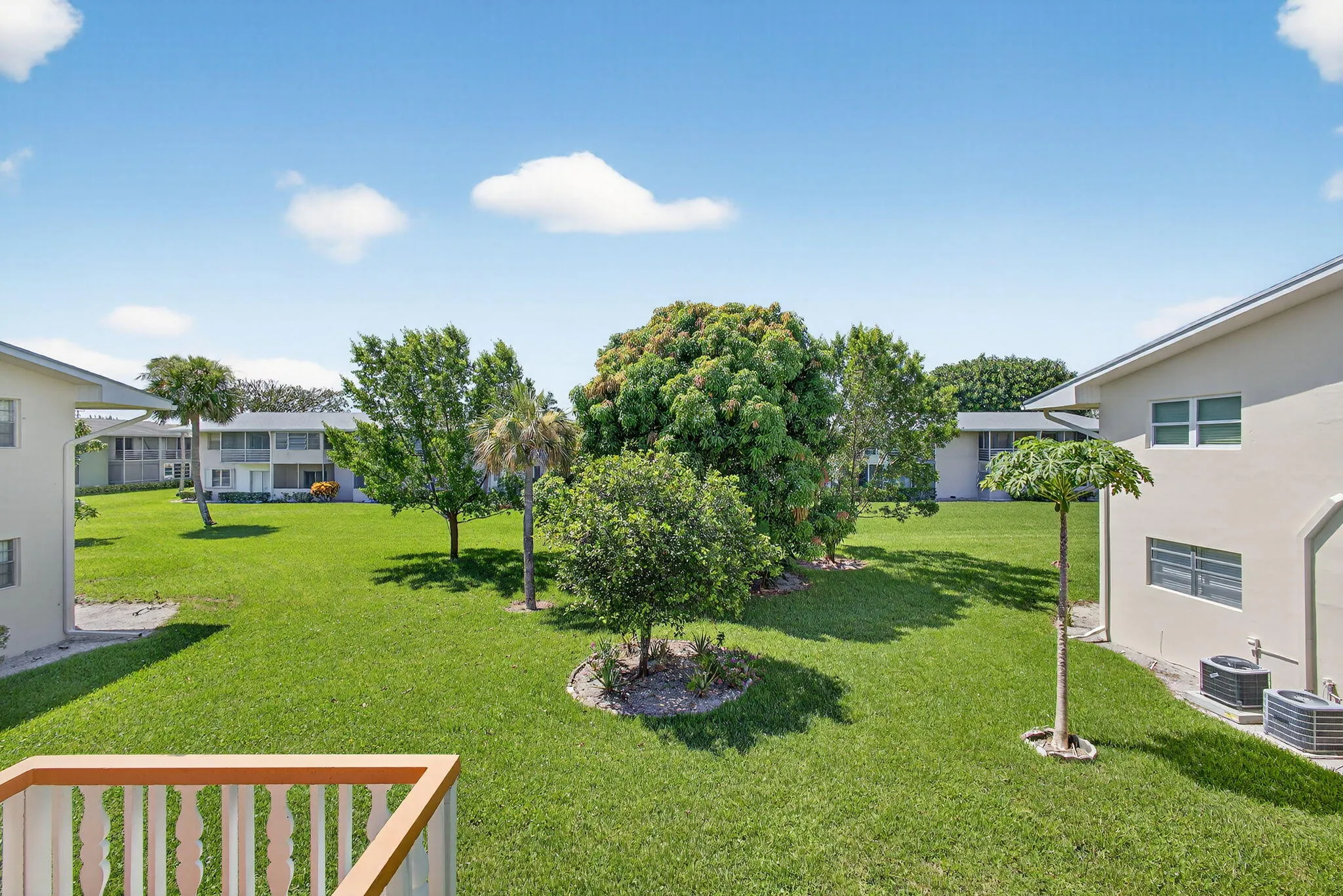 Expansive green spaces with mature trees and landscaping