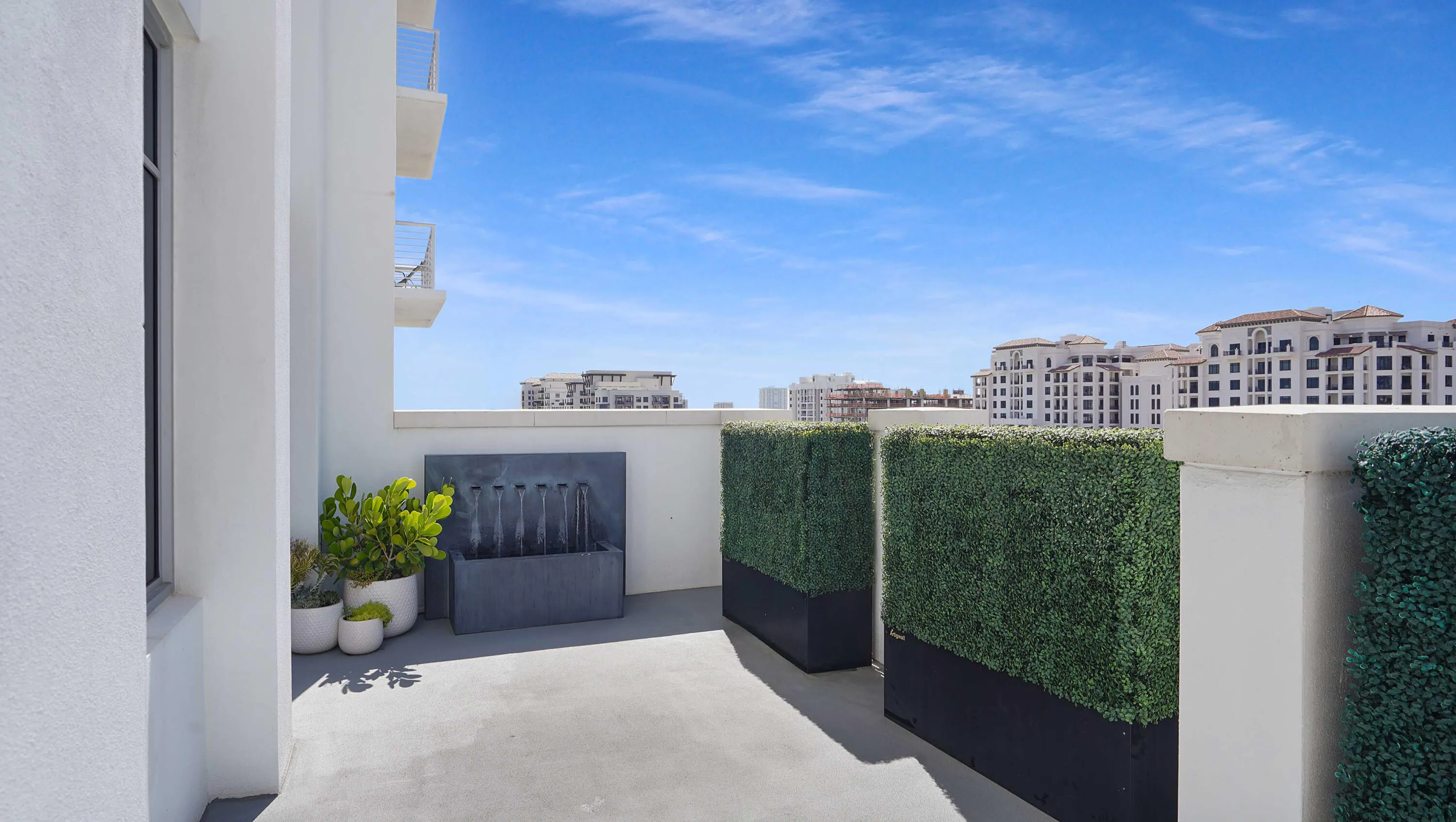 The south-facing terrace extends the architecture outdoors, creating a distinct open-air living space. VIRTUALLY ADJUSTED.
