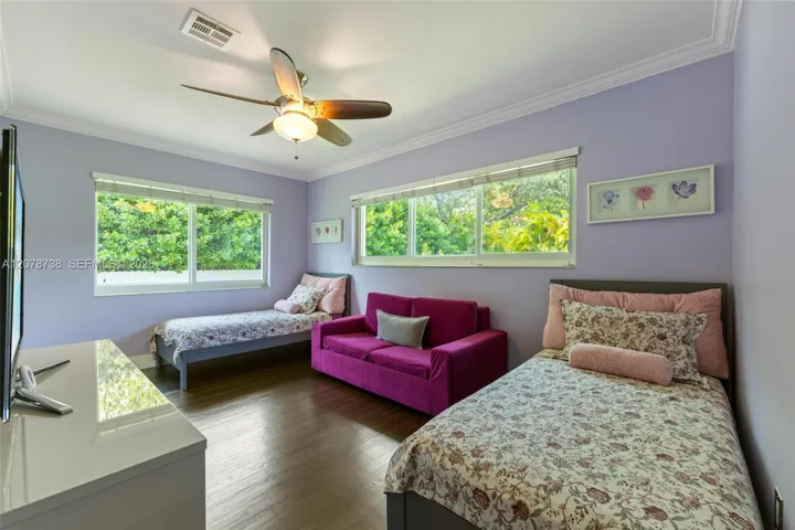 A bright, spacious bedroom with room to sleep, play, relax, and make it completely their own.