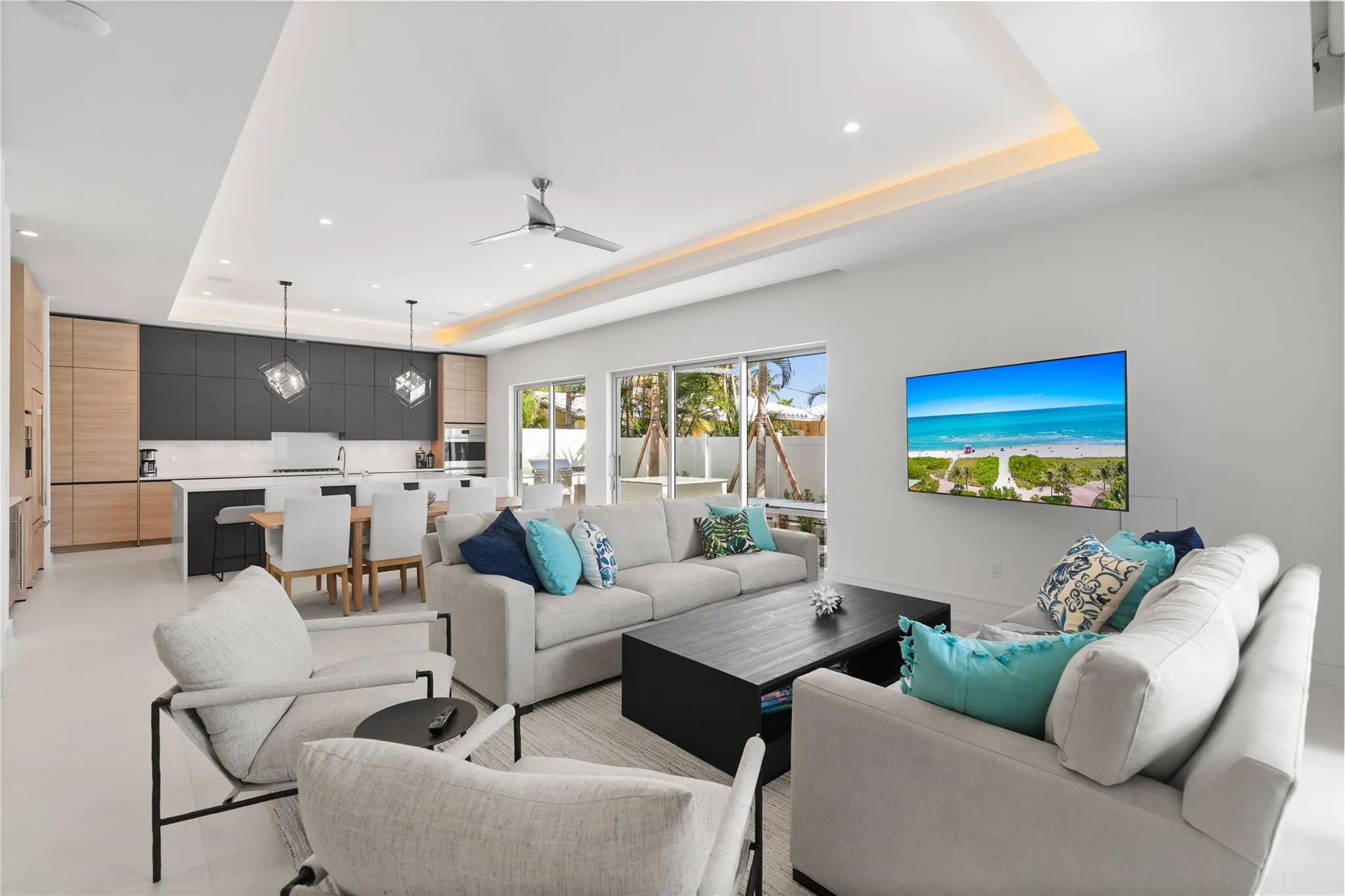 Open concept living area and kitchen - A remarkable luxury townhome rental that redefines upscale living in the heart of Lauderdale By The Sea. This beautifully designed 3,027 sq. ft residence features 4 spacious beds & 4 baths, making it perfect for families or those who love to entertain.The home also offers an outdoor kitchen and BBQ area, along with a private plunge pool that invites relaxation and fun. For boating enthusiasts, a boat slip is also available for rent. Easy access to a plethora of amenities, beach, dining, & entertainment.