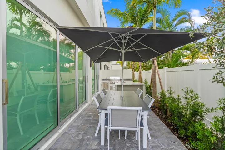 221 Shore Ct Patio Area Featuring Private Plunge Pool, Gas Fireplace, Outdoor Kitchen, and more!