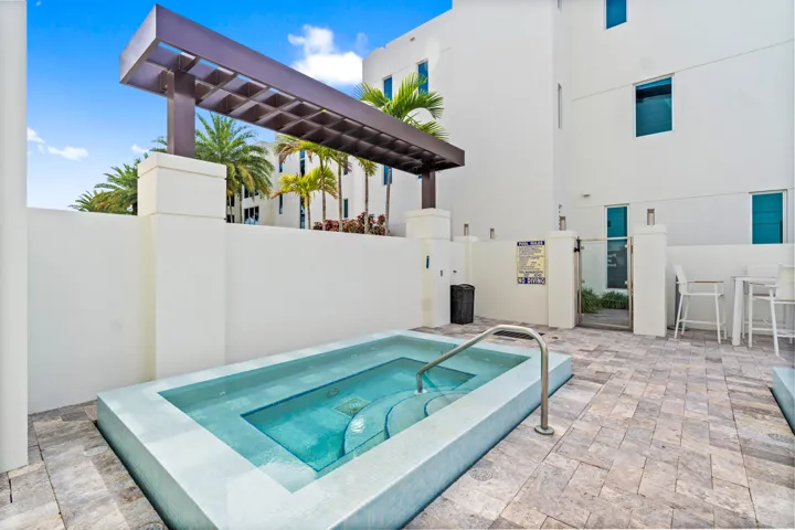 221 Shore Ct Community Pool. A remarkable luxury townhome rental that redefines upscale living in the heart of Lauderdale By The Sea. This beautifully designed 3,027 sq. ft residence features 4 spacious beds & 4 baths, making it perfect for families or those who love to entertain.The home also offers an outdoor kitchen and BBQ area, along with a private plunge pool that invites relaxation and fun. For boating enthusiasts, a boat slip is also available for rent. Easy access to a plethora of amenities, beach, dining, & entertainment.