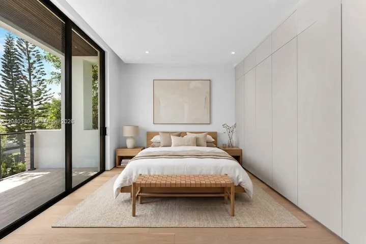 Guest Bedroom. Disclaimer: Several photographs presented in this listing contain digitally added furniture, artwork, and decor. These virtually staged images are intended solely for illustrative purposes.