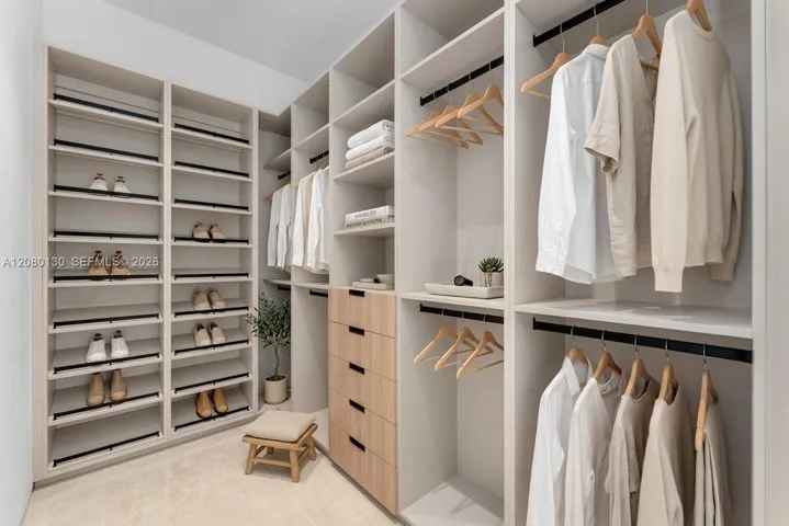 Guest Closet. Disclaimer: Several photographs presented in this listing contain digitally added furniture, artwork, and decor. These virtually staged images are intended solely for illustrative purposes.