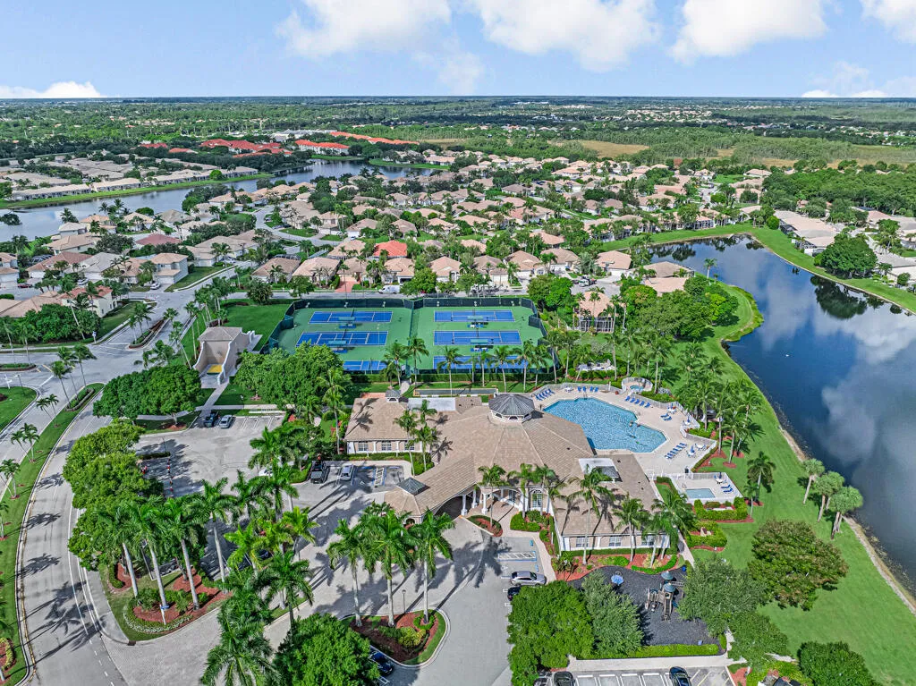 Resort-style community with a clubhouse, swimming pool, and tennis courts