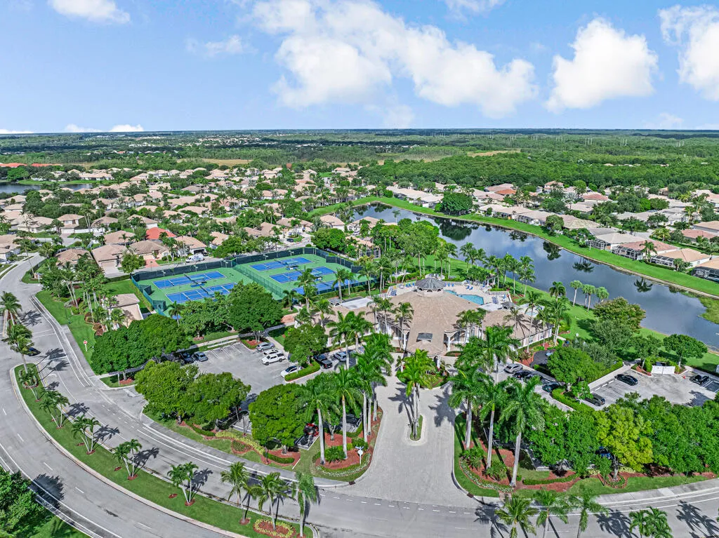 Community with multiple tennis courts, a resort-style pool, and a clubhouse