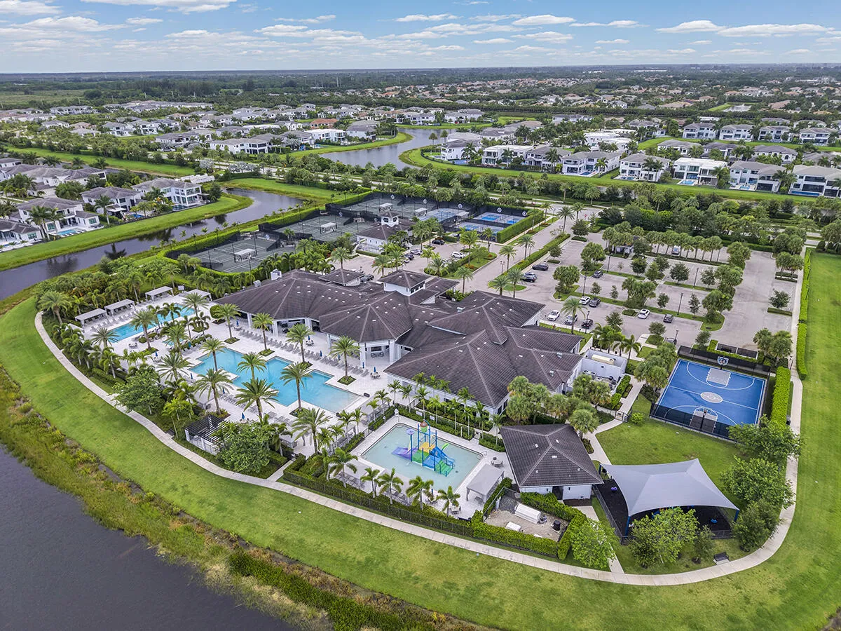 Extensive community amenities featuring multiple swimming pools, sports courts, a playground, and lush landscaping