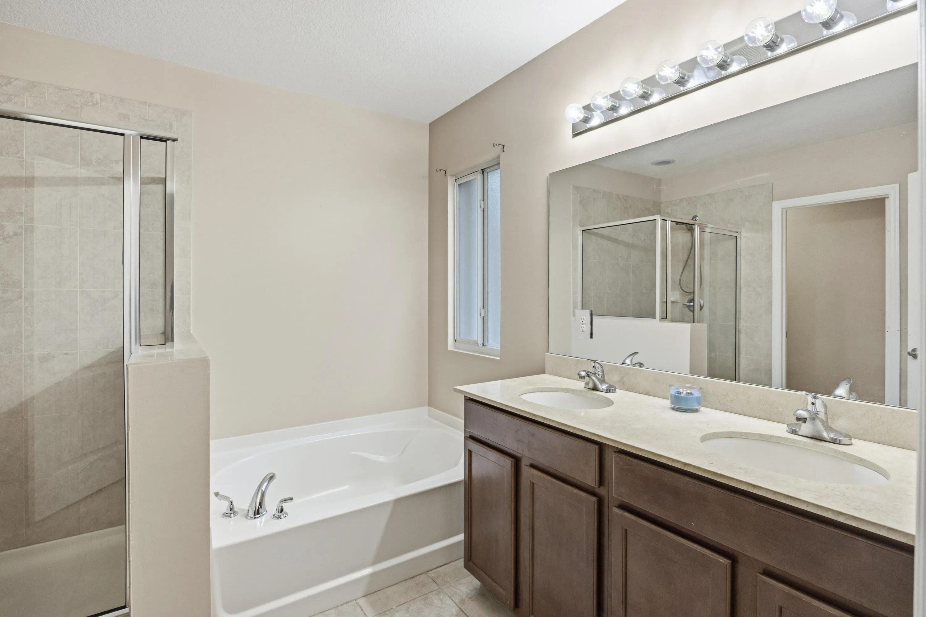 Dual vanity with integrated sinks and a light-toned countertop