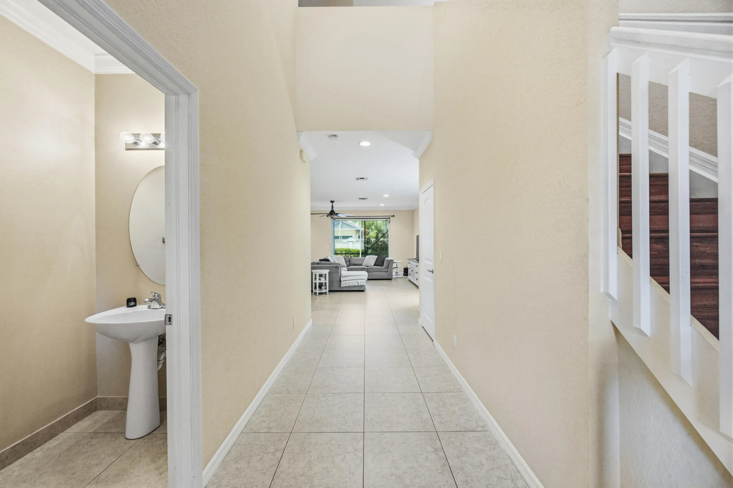 Tile flooring extends through the hallway