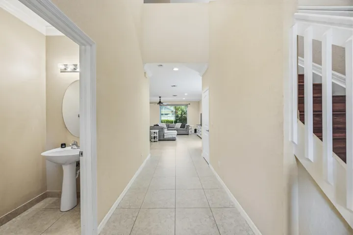 Tile flooring extends through the hallway