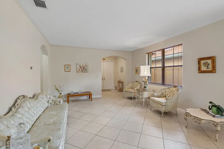 Formal living & dining with an open, airy feel. The home has high ceilings, tile floors and spacious rooms through the home.