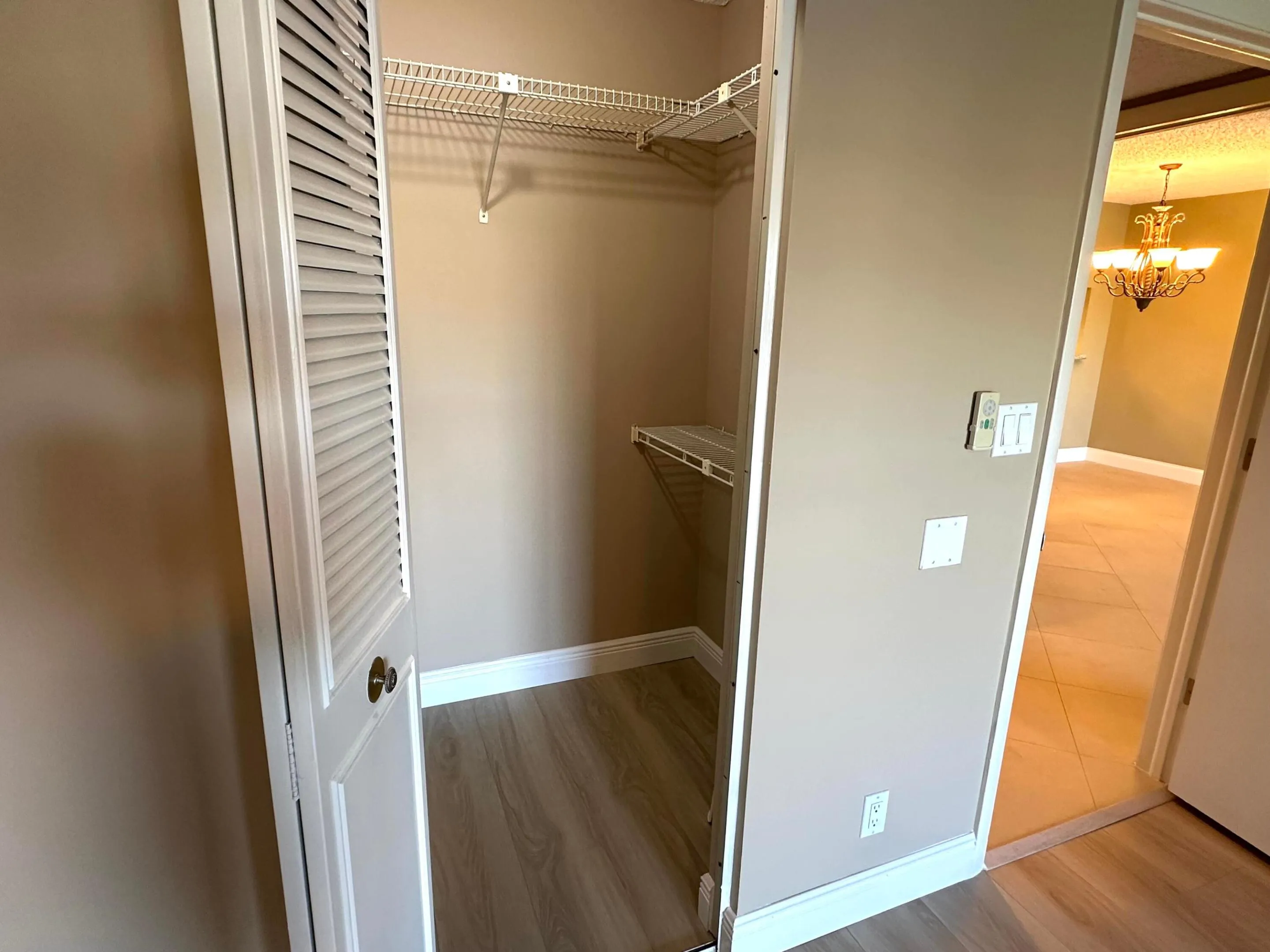 2 of 2 walk in closets in primary bedroom