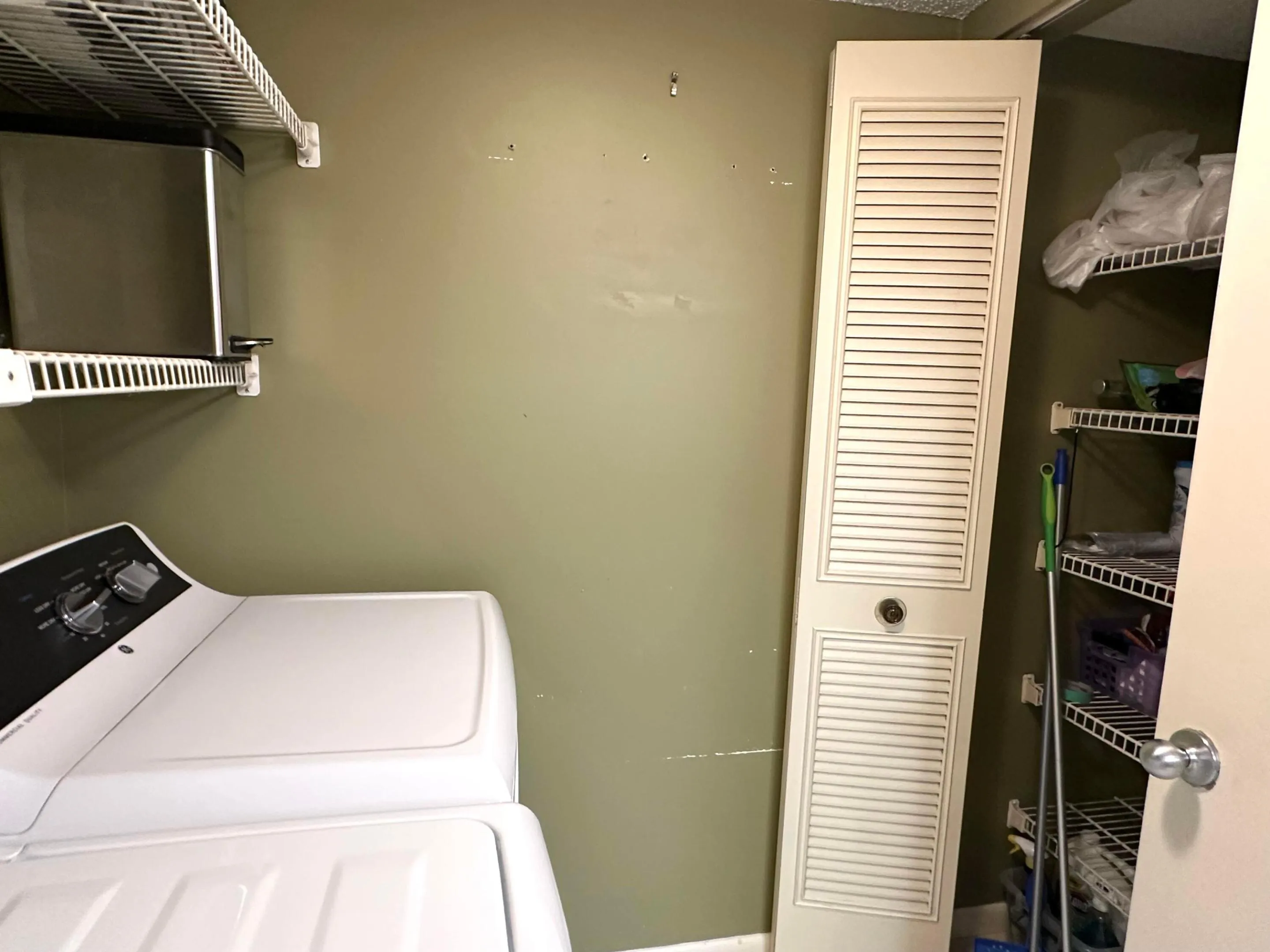 Separate laundry room with storage closet
