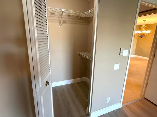 2 of 2 walk in closets in primary bedroom