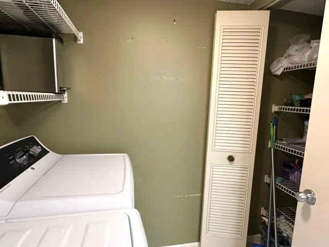 Separate laundry room with storage closet