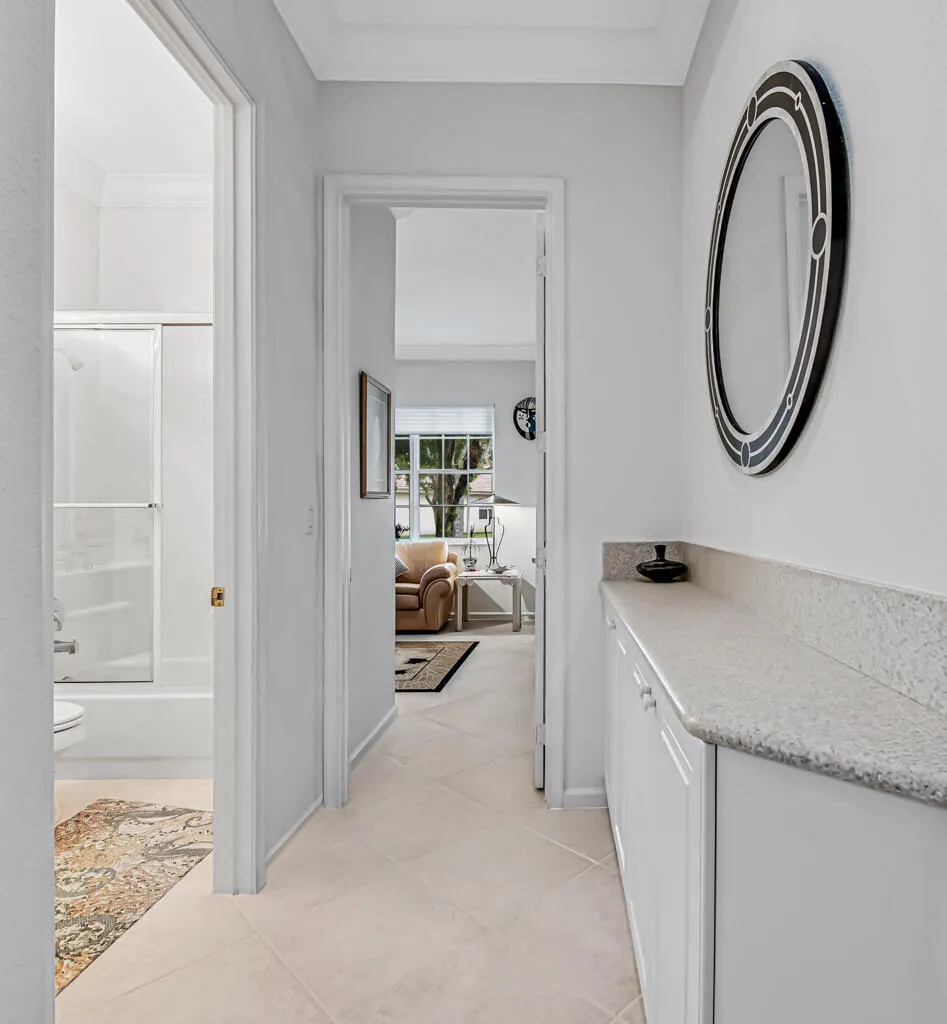 Hallway between guest bedrooms with 3rd bath and more storage