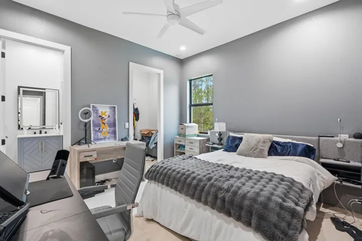 Recessed lighting, ceiling fan, and large window with exterior scenery
