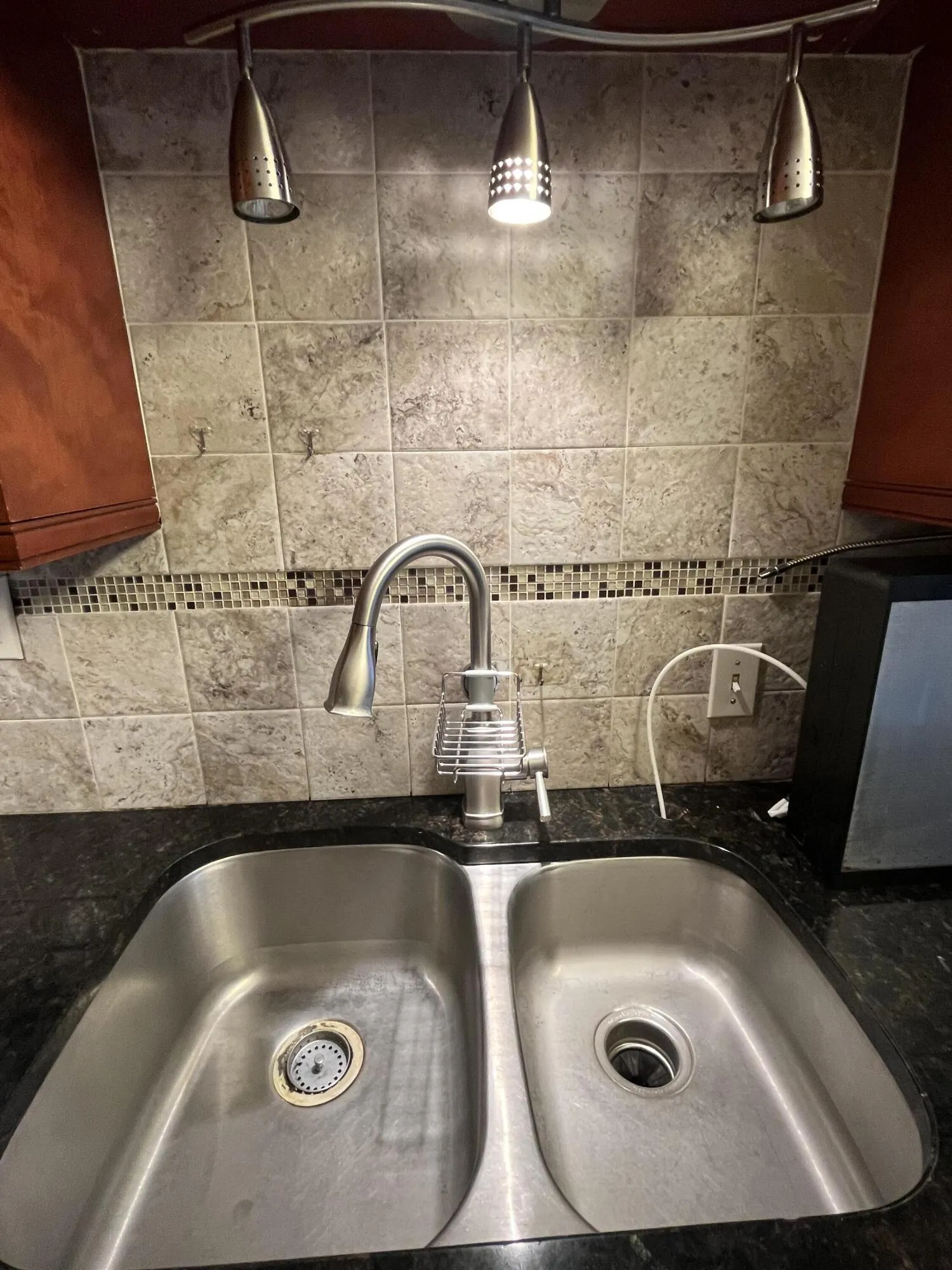 backsplash and double inlaid stainless steel sink
