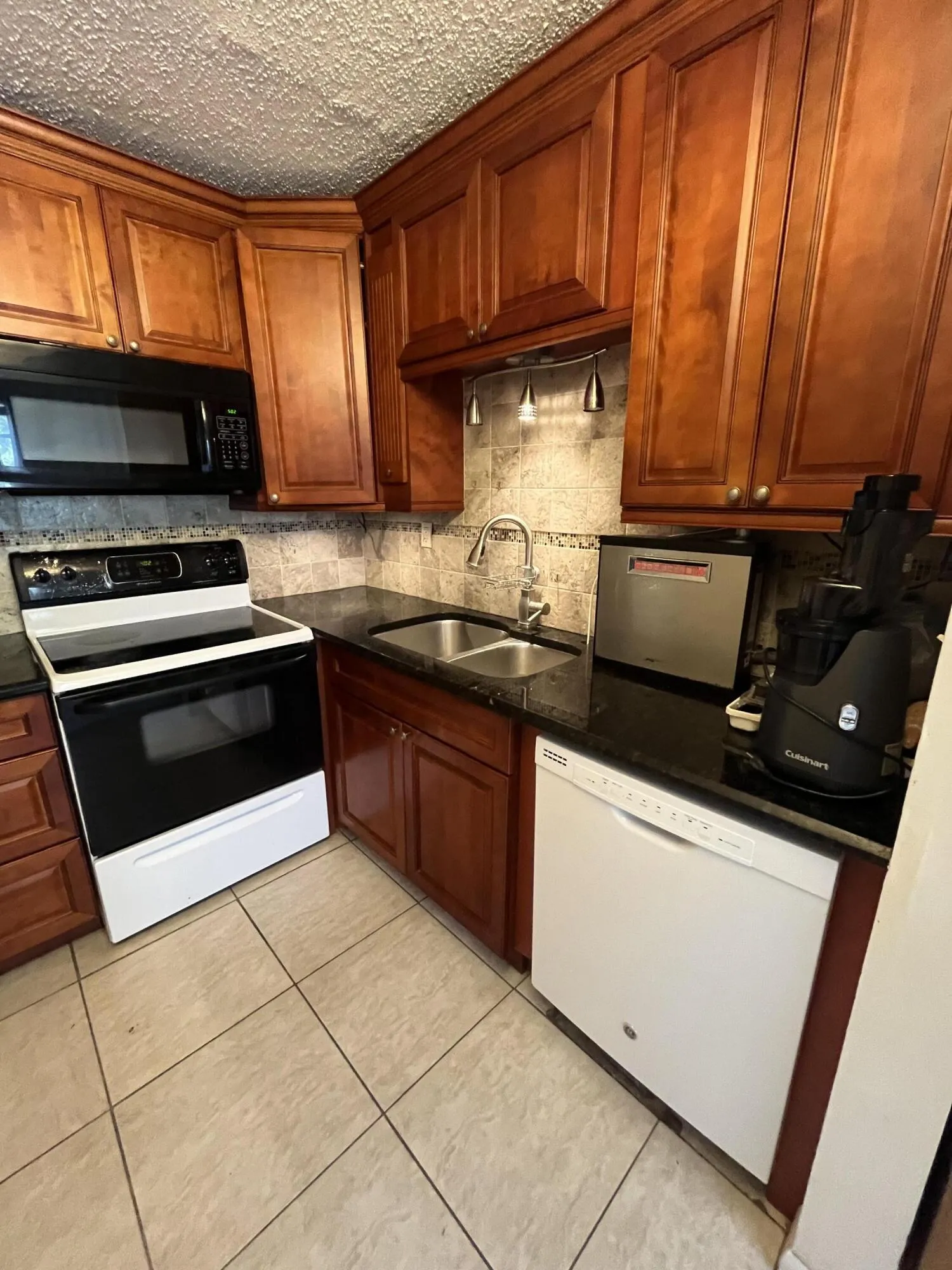 Updated kitchen with brown wood cabinetry