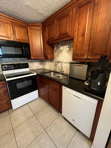 Updated kitchen with brown wood cabinetry