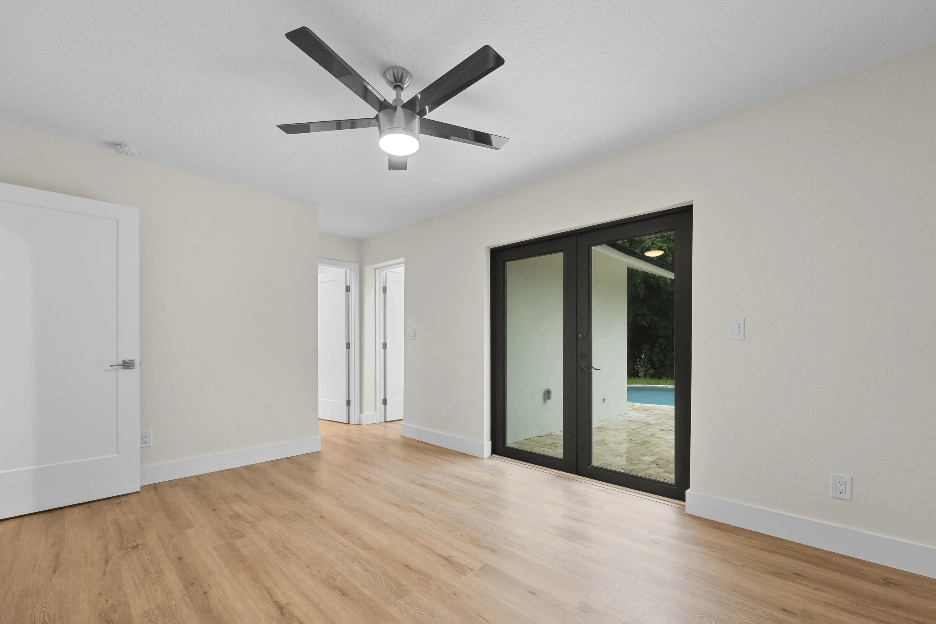 Primary views of pool, looking to walk in closet and bathroom
