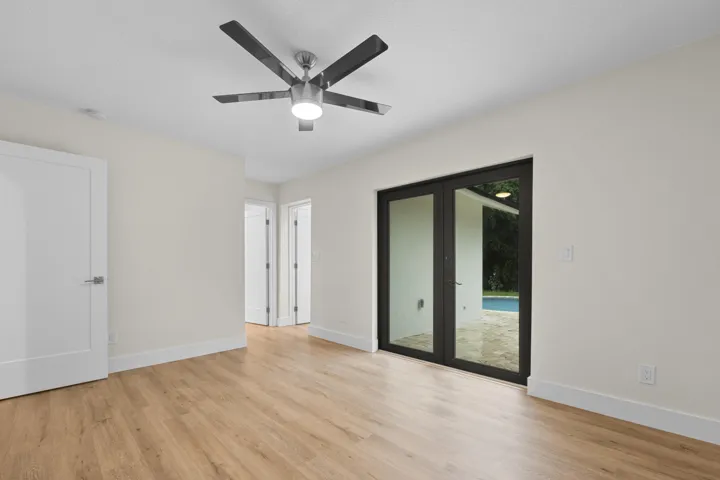 Primary views of pool, looking to walk in closet and bathroom
