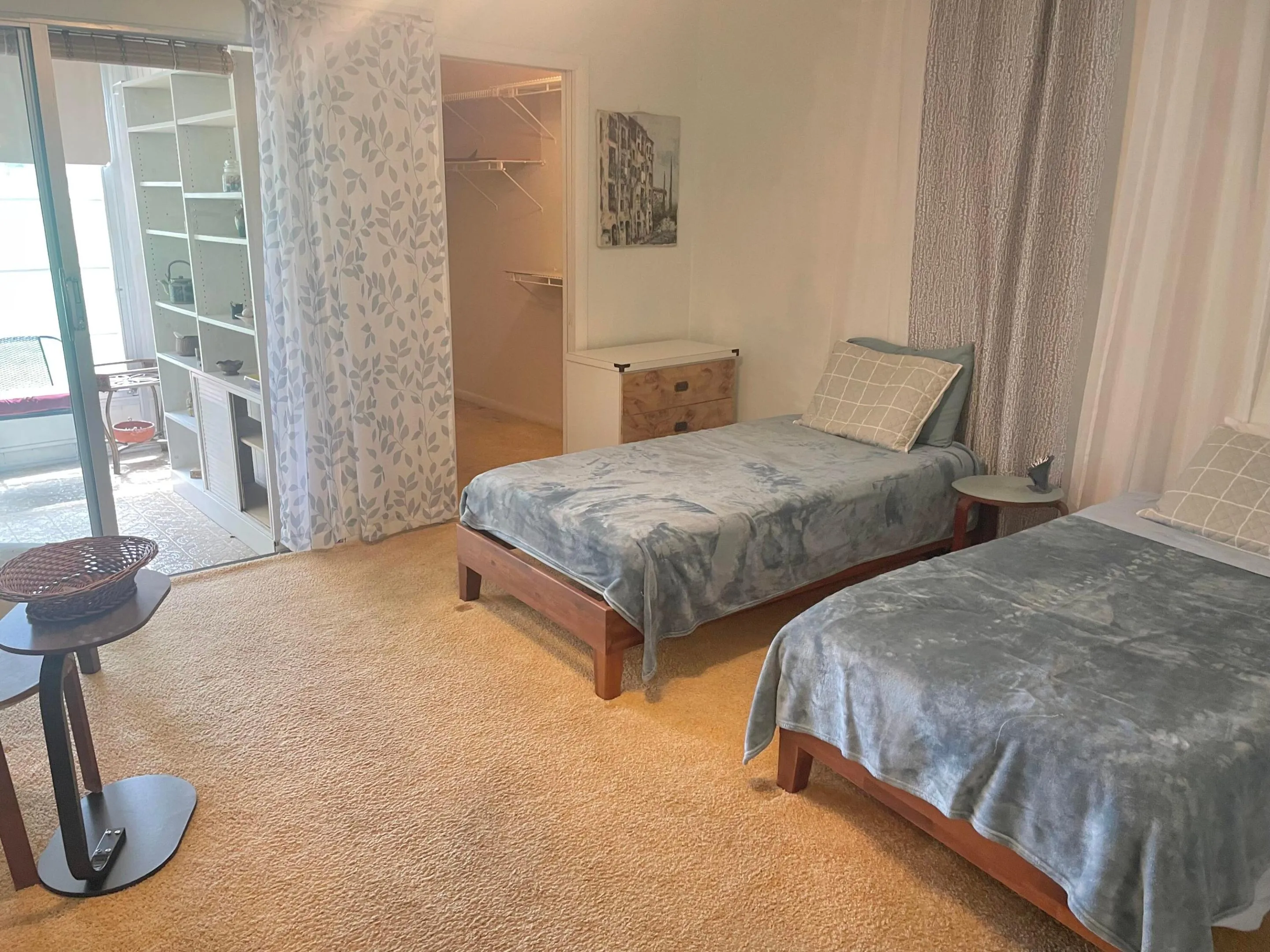 Primary Bedroom with Walk In Closet and Sliding Doors to the Patio