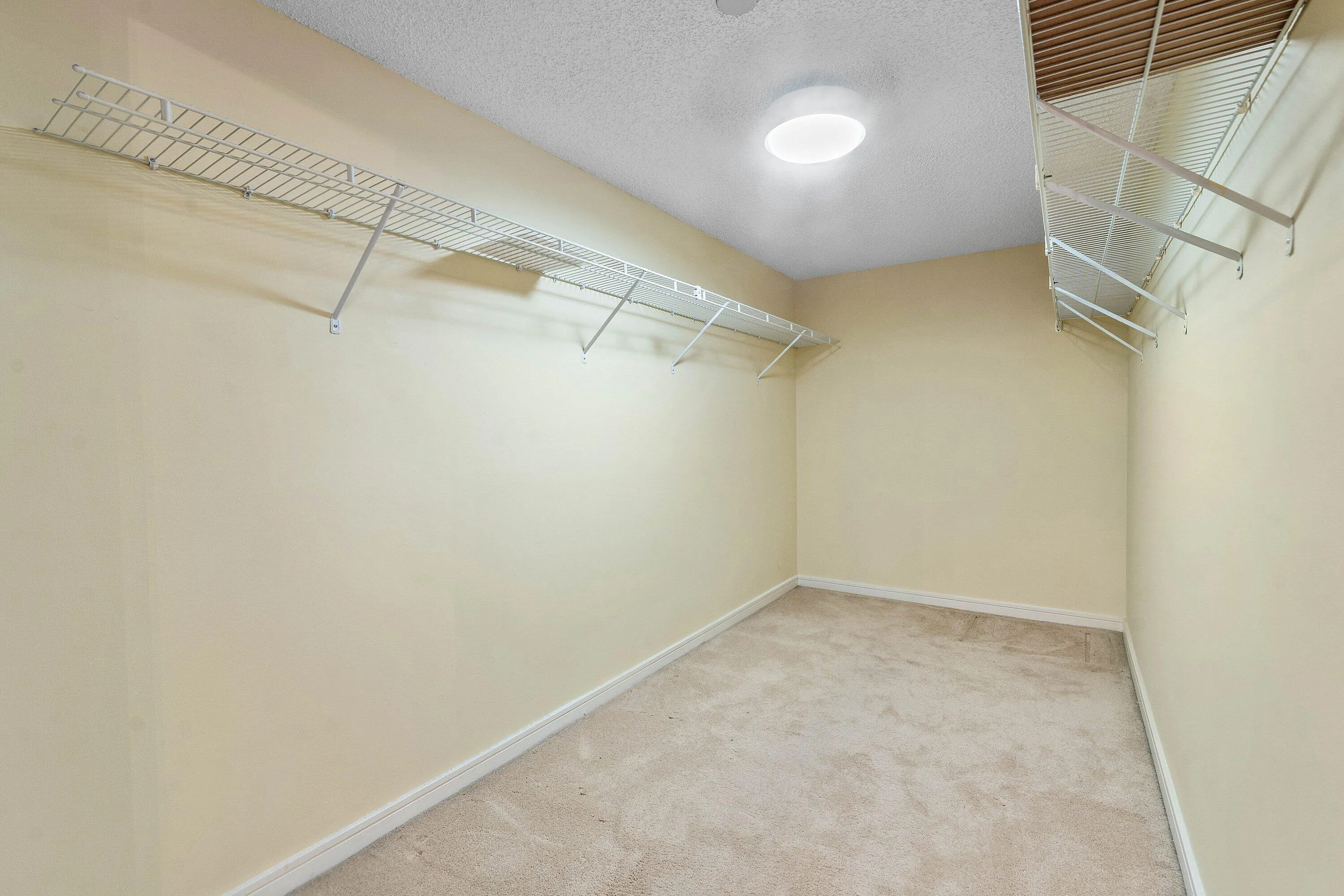 1 of 4 Large walk-in closets in the master bedroom provides substantial hanging and storage capacity.