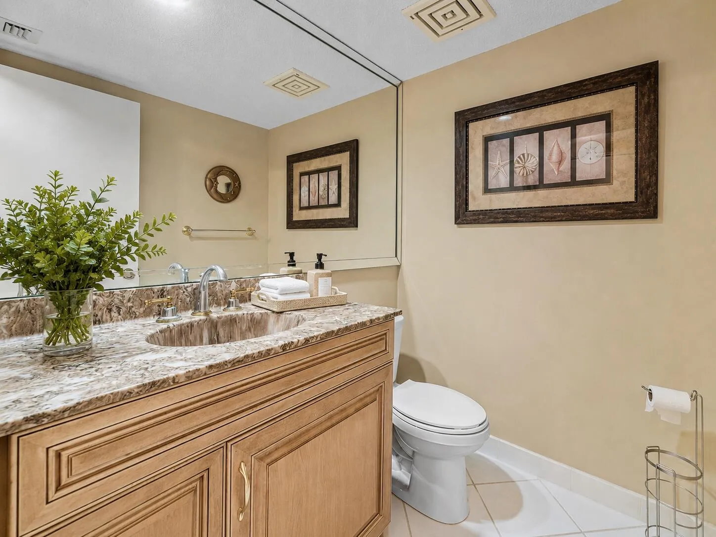Powder bathroom: Convenient powder room serves guests without entering either bedroom suite.