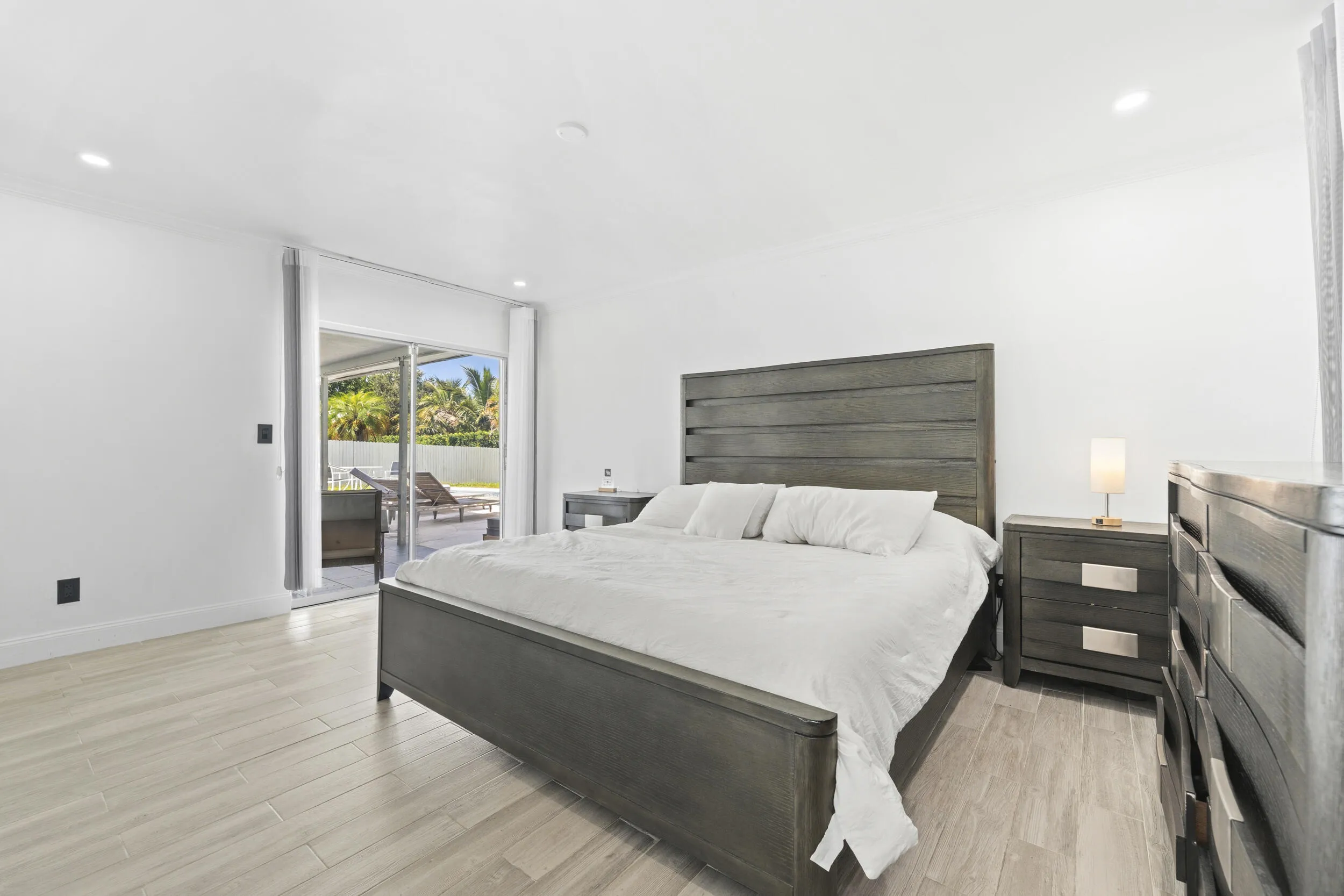 Light-toned wood-finish flooring with recessed ceiling lights
