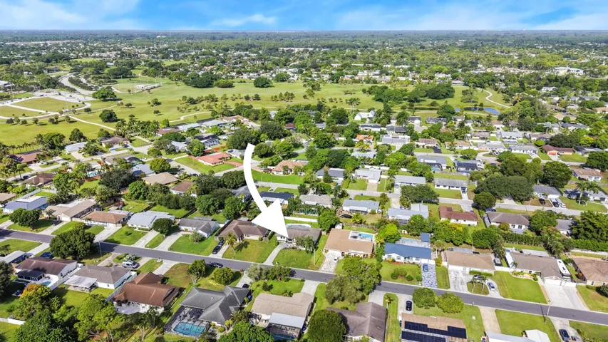 Residential neighborhood with mature trees and green spaces