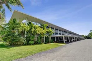 BUILDING EXTERIOR WITH COVERED PARKING