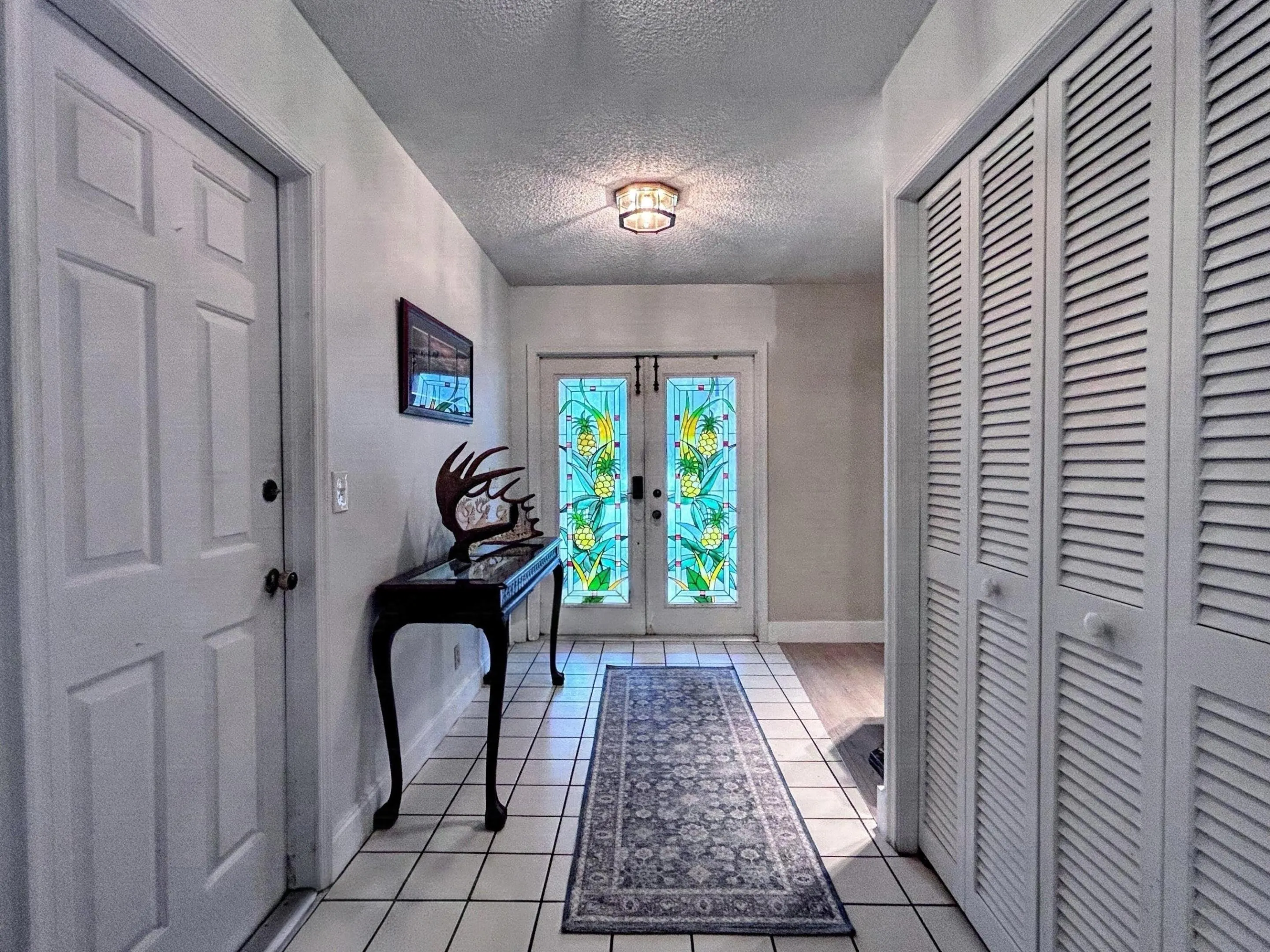 Foyer with storage closet