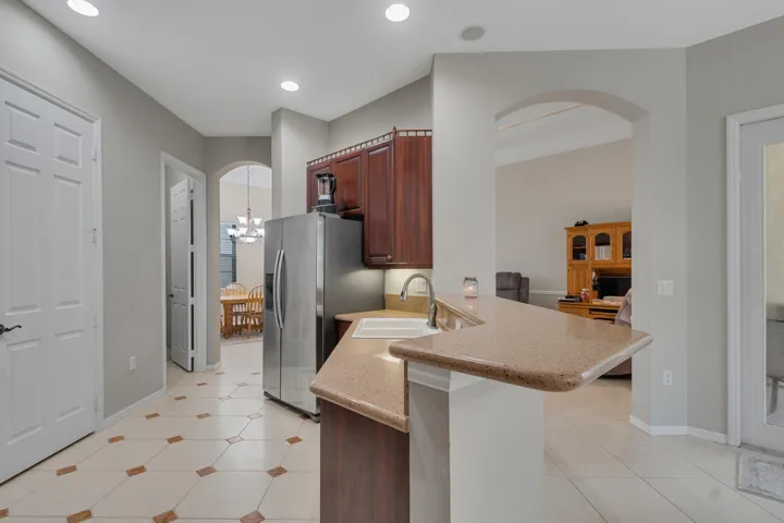 Large kitchen, well-equipped. Peninsula Bar; large pantry.
