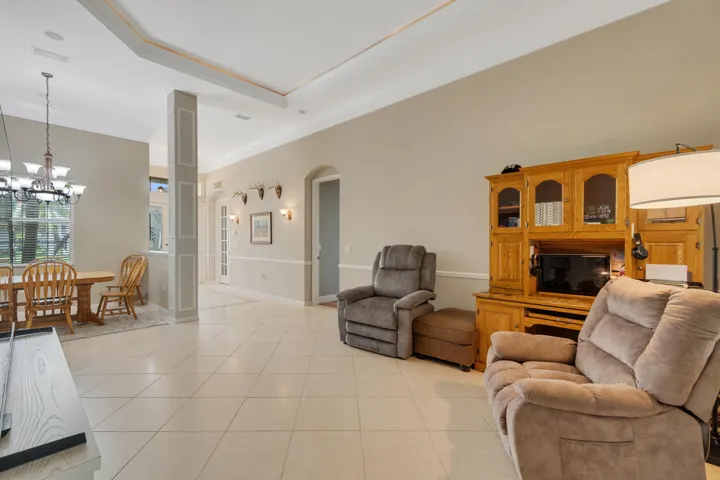 Large Great Room with Crown Mouling Defined tray ceiling hiding recessed lighting.