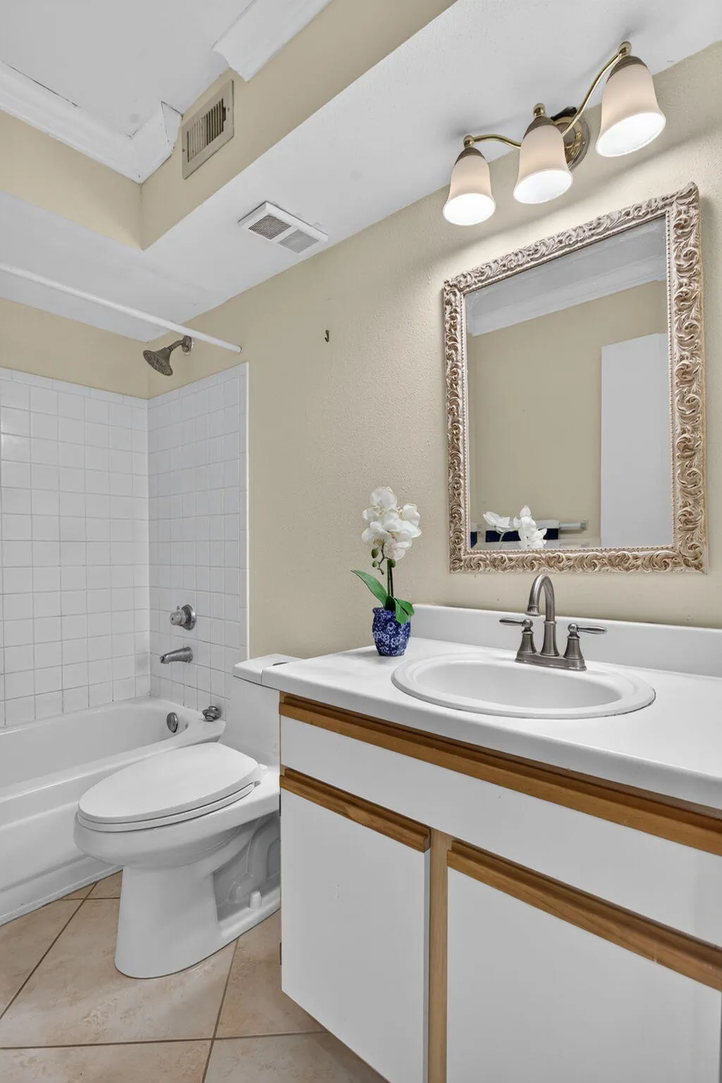White tile shower surround with a built-in bathtub