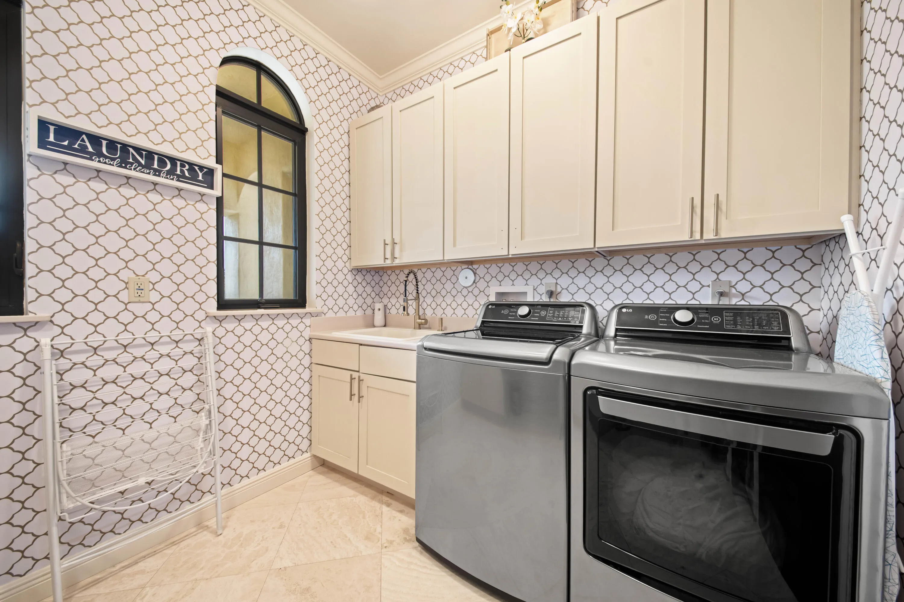 Expansive Laundry Suite with sink and ample storage