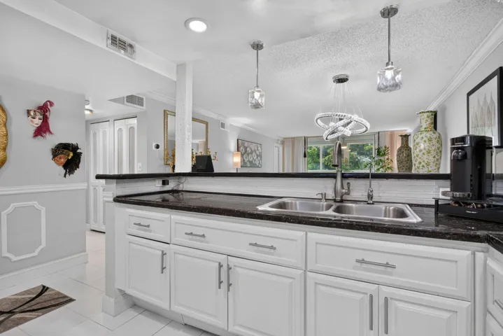 CUSTOM, OPEN CONCEPT KITCHEN WITH LARGE SNACK BAR FOR ENTERTAINING
