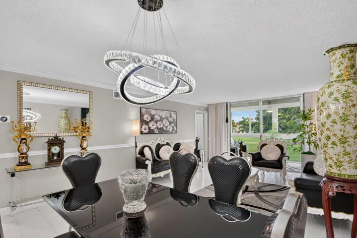 ELEGANT DINING AREA WITH A UNIQUE CHANDELIER