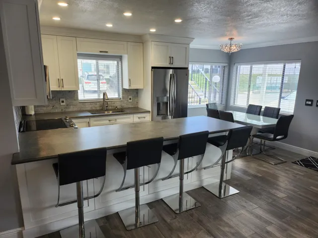 111-view of bar-kitchen-dining area