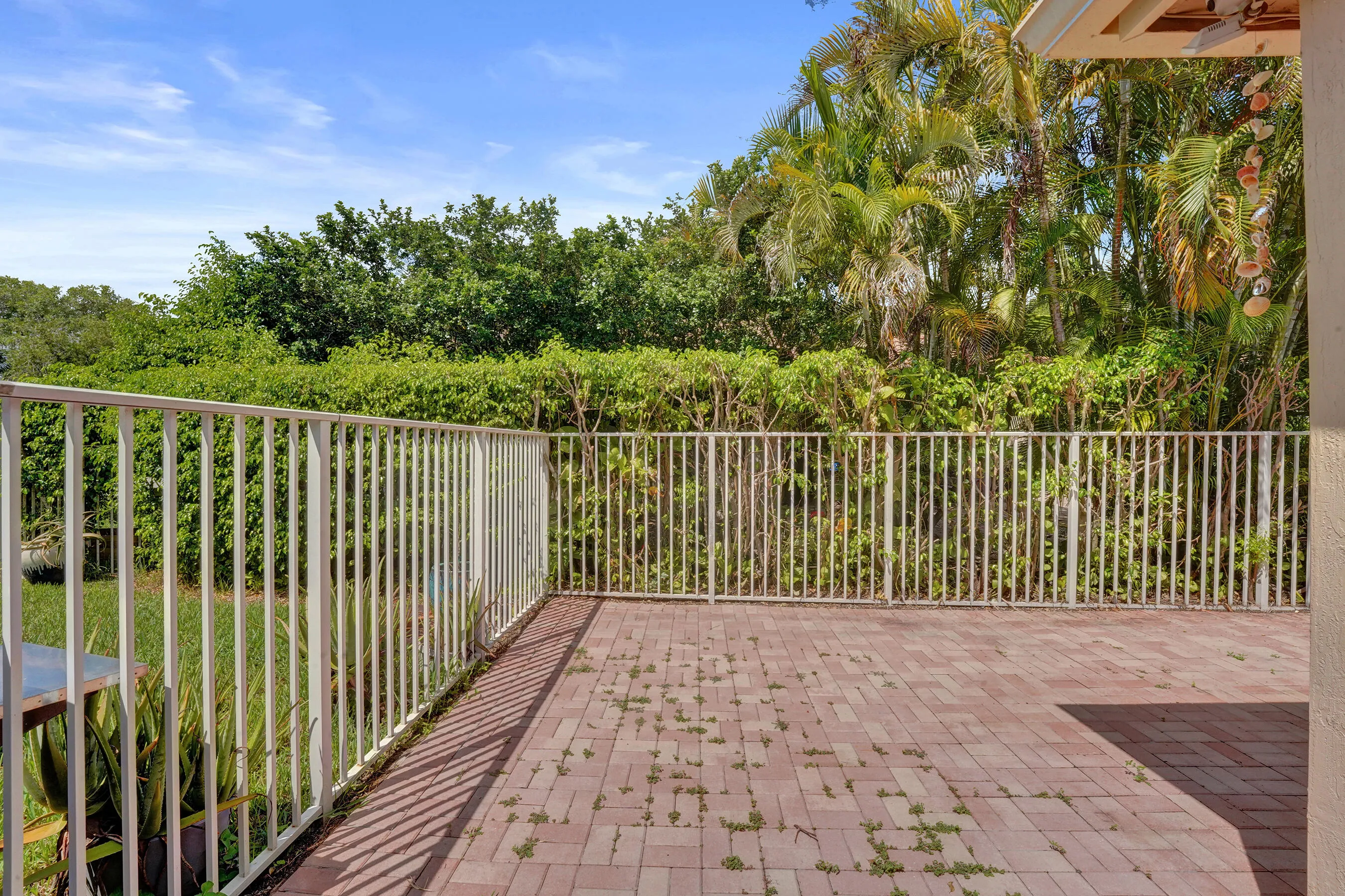 Fenced paver patio