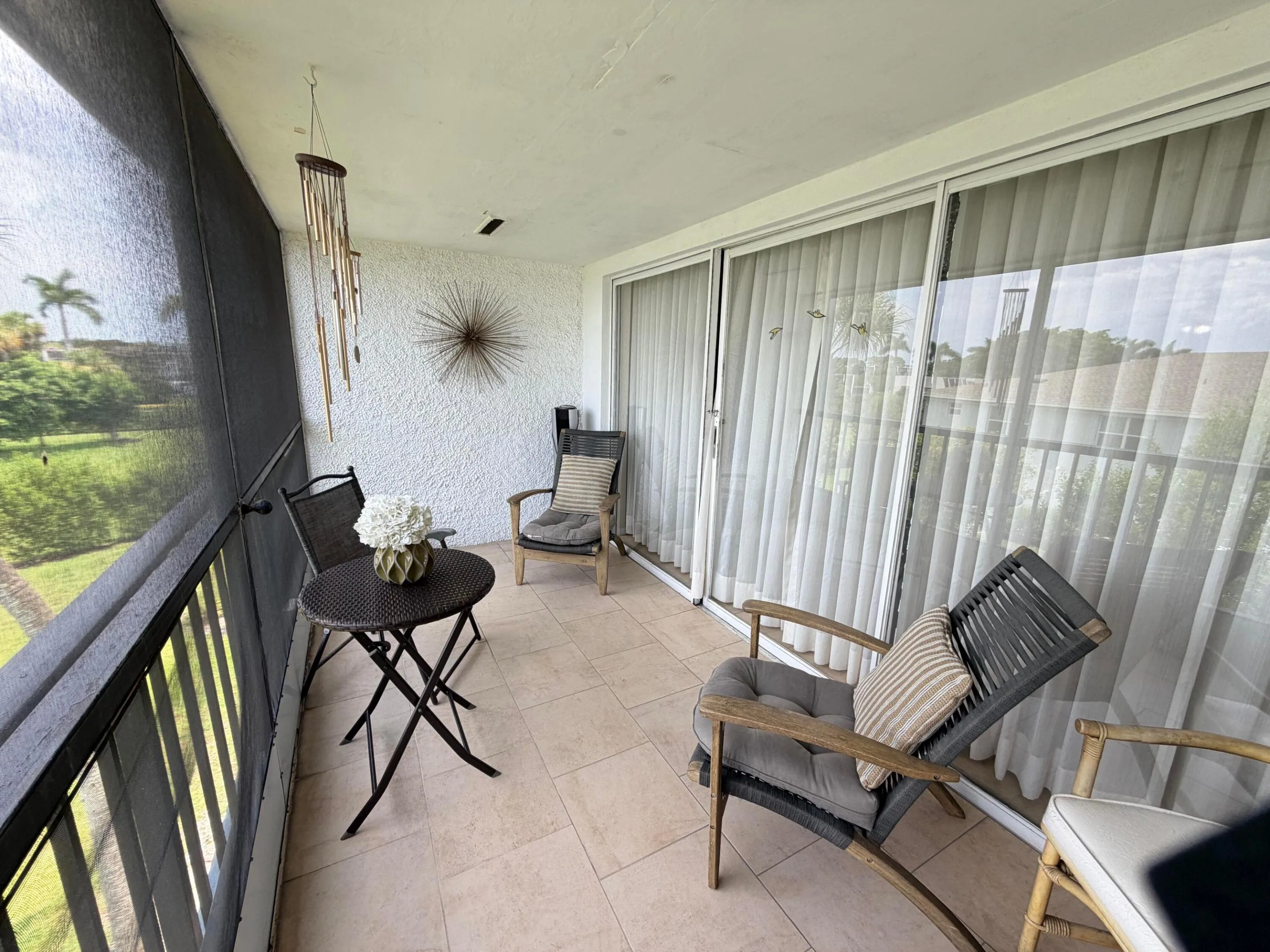 SCREENED BALCONY OVERLOOKING GOLF COURSE