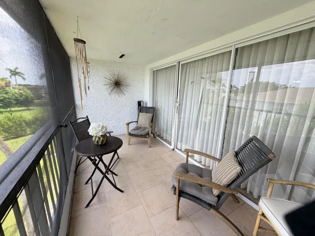 SCREENED BALCONY OVERLOOKING GOLF COURSE