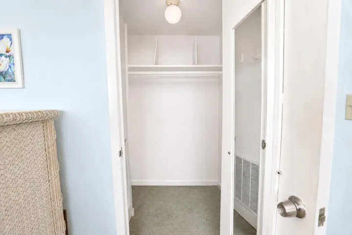 Primary bedroom walk in closet.