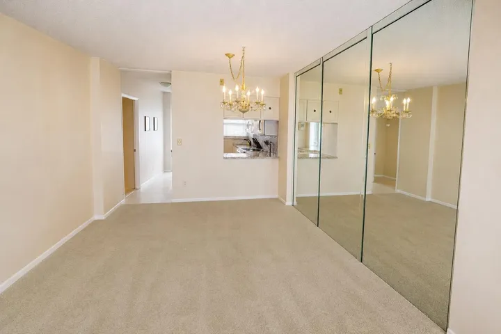 Dining room and living room, furniture removed. DIGITALLY ENHANCED