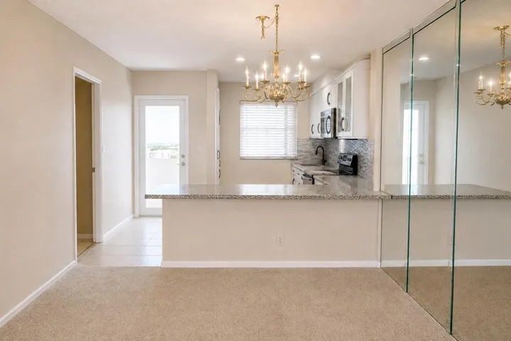 Kitchen with wall removed. DIGITALLY ENHANCED